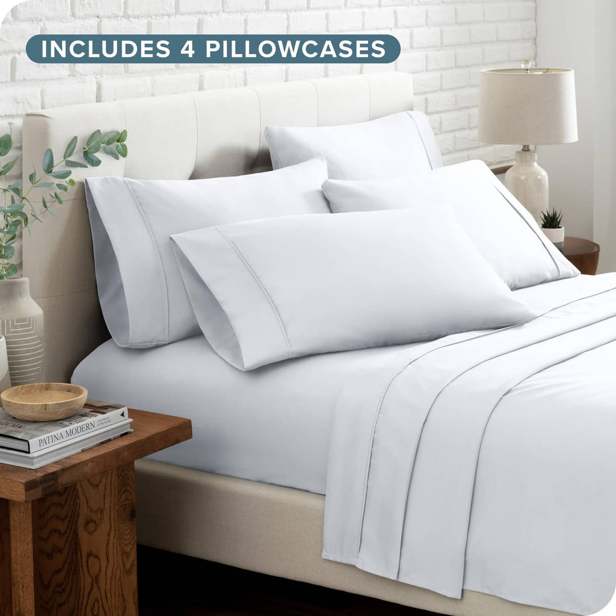 White queen sheet set with four pillowcases and layered bed linens