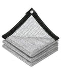 Reflective shade cloth stack, silver aluminum mesh with black reinforced edges and grommet corners