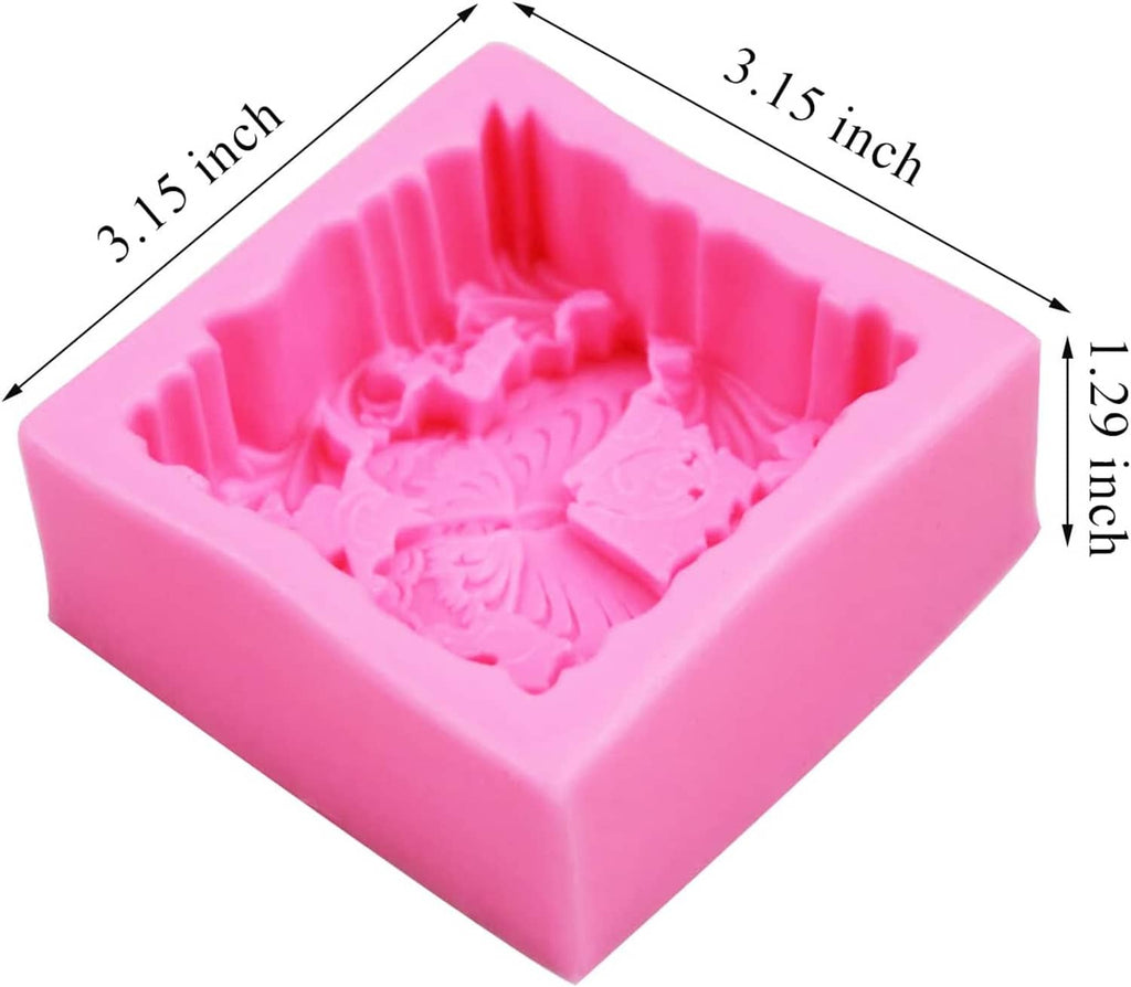 Pink silicone soap mold with raised butterfly and floral design, single square cavity