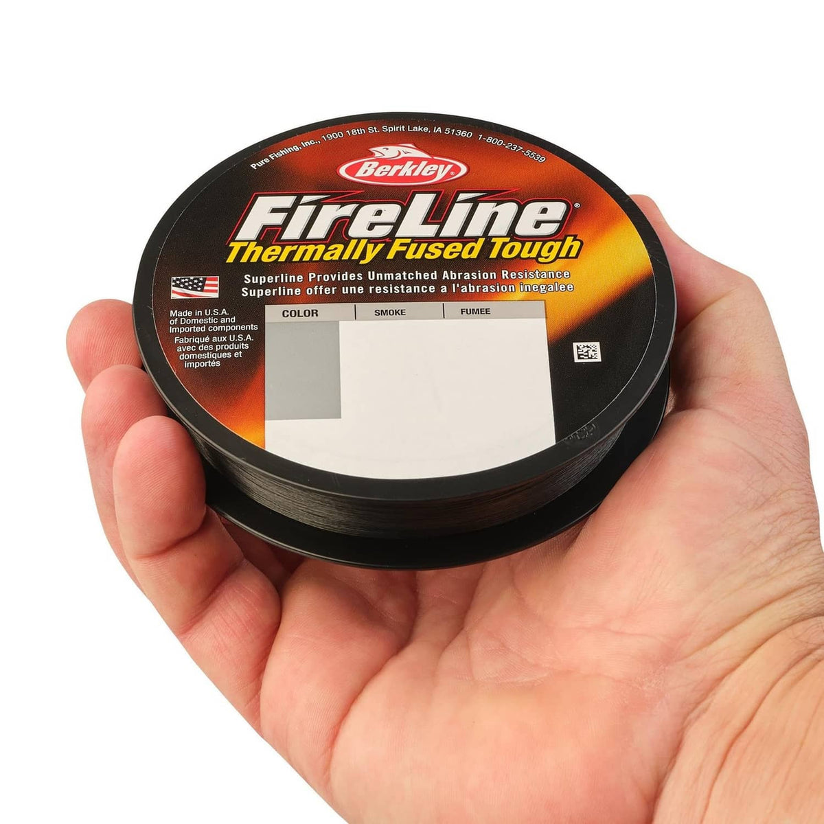 Berkley FireLine Thermally Fused Tough line spool in hand, dark smoke color