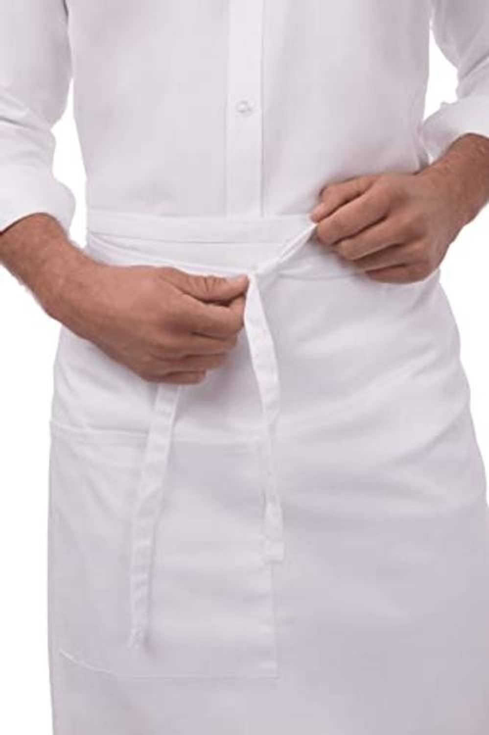 White apron close-up showing waist tie knot and buttoned front placket.