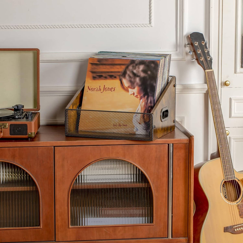 Rustic brown record storage crate with black mesh panel and side slot handles on stand