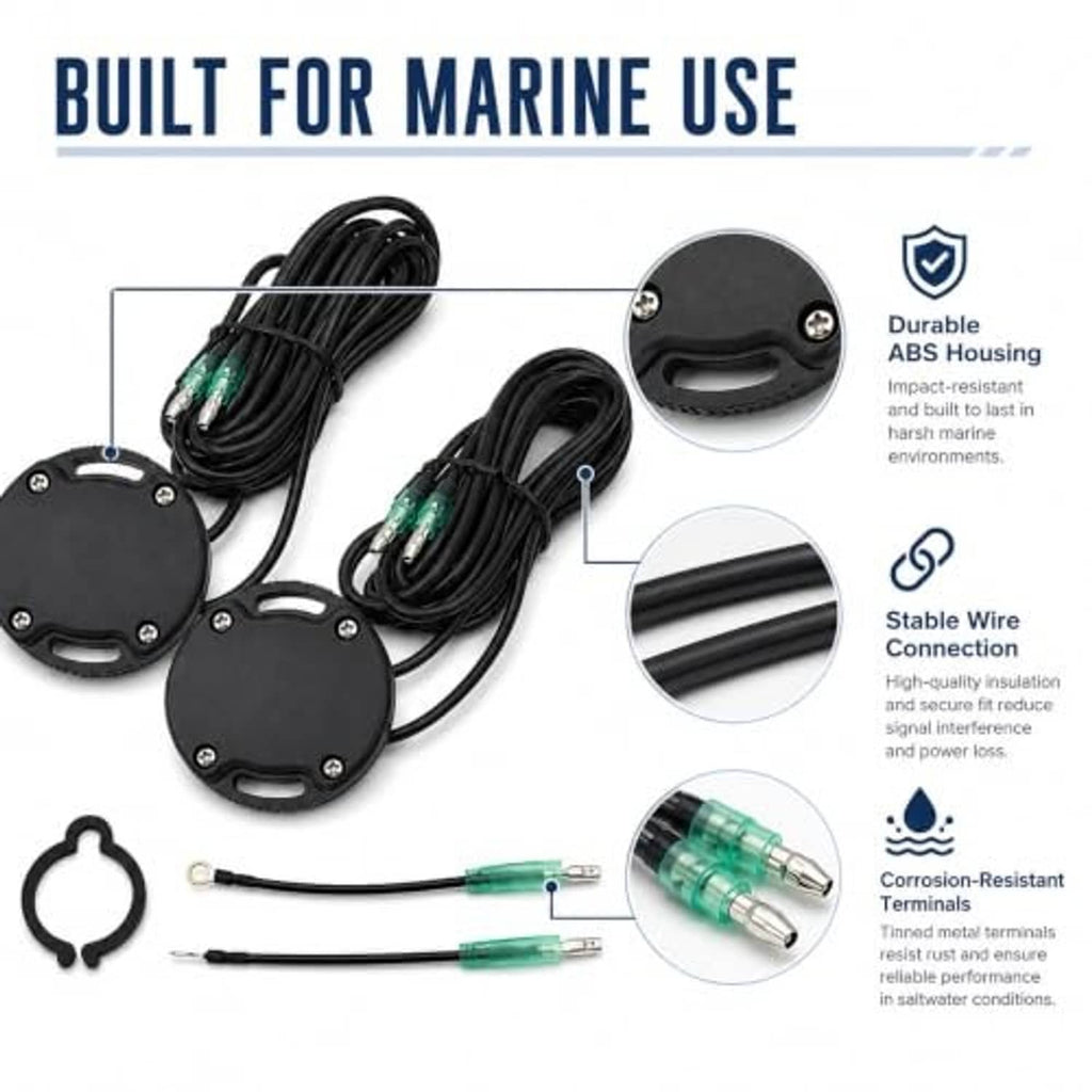 Two black sender housings with green terminals, bundled wiring, and retaining clip