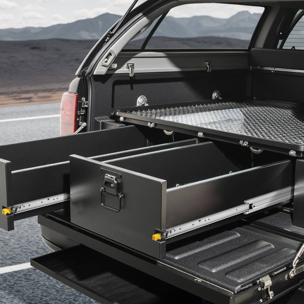 Heavy-duty drawer slide installed in truck cargo drawer, steel rails with yellow release tabs