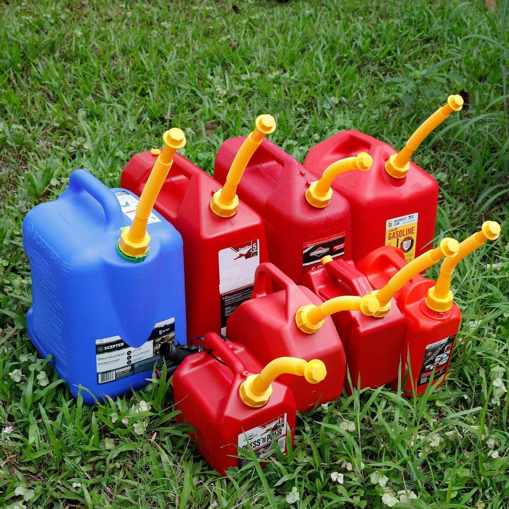 Yellow spout nozzles attached to portable gas cans with replacement kit parts