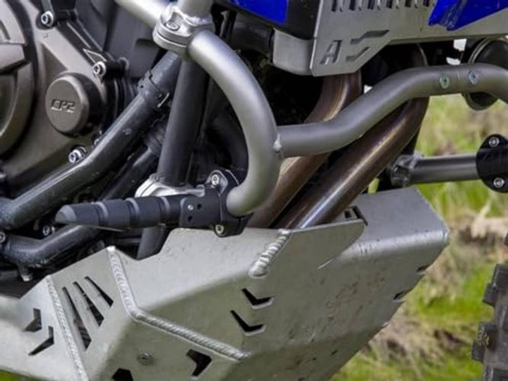 Close-up of black highway peg mounting on crash bar with fasteners