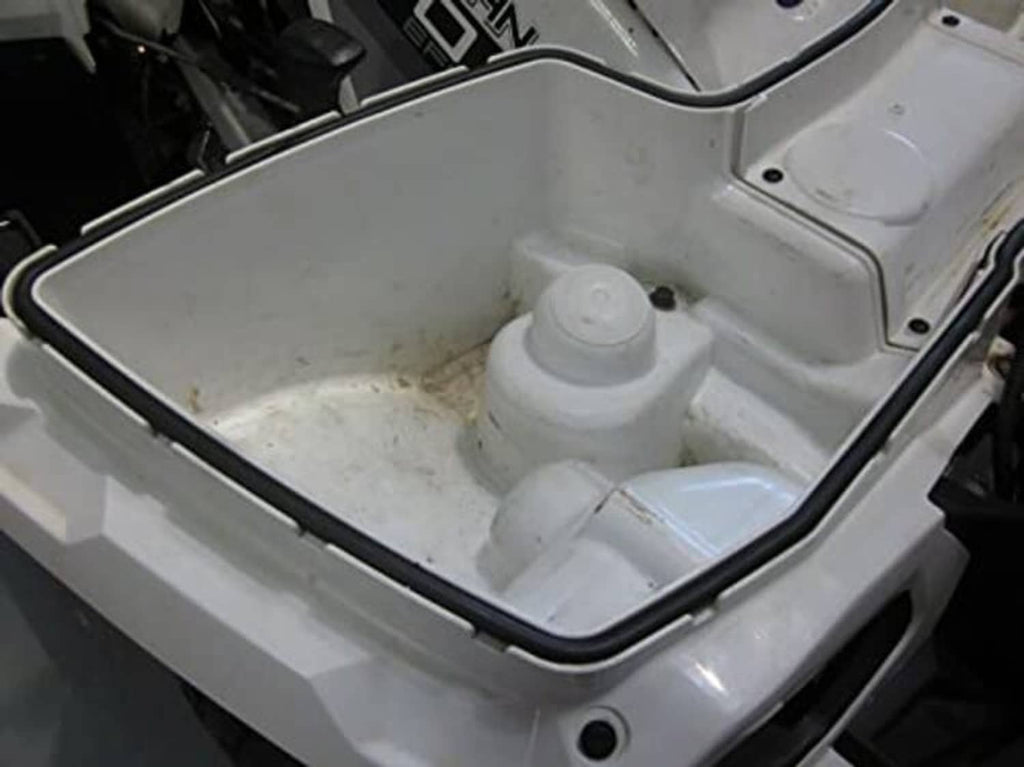 Front rack storage compartment with black rubber seal around the lid opening