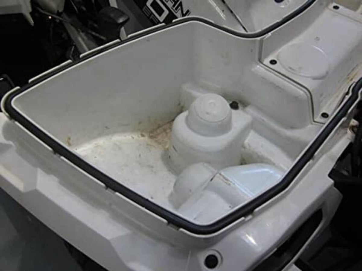 Front rack storage compartment with black rubber seal around the lid opening