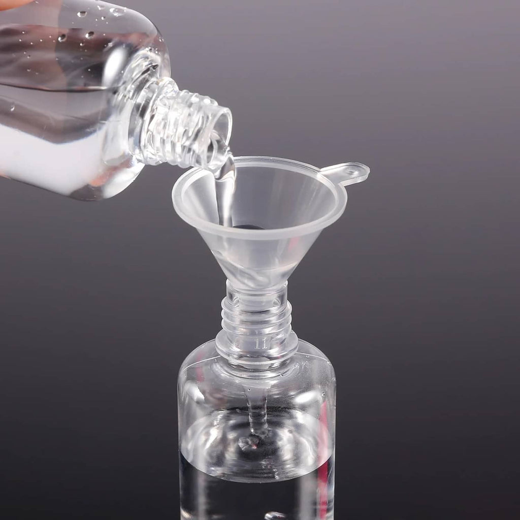 Perfume funnel extractor pouring into bottle with clear plastic transfer tool