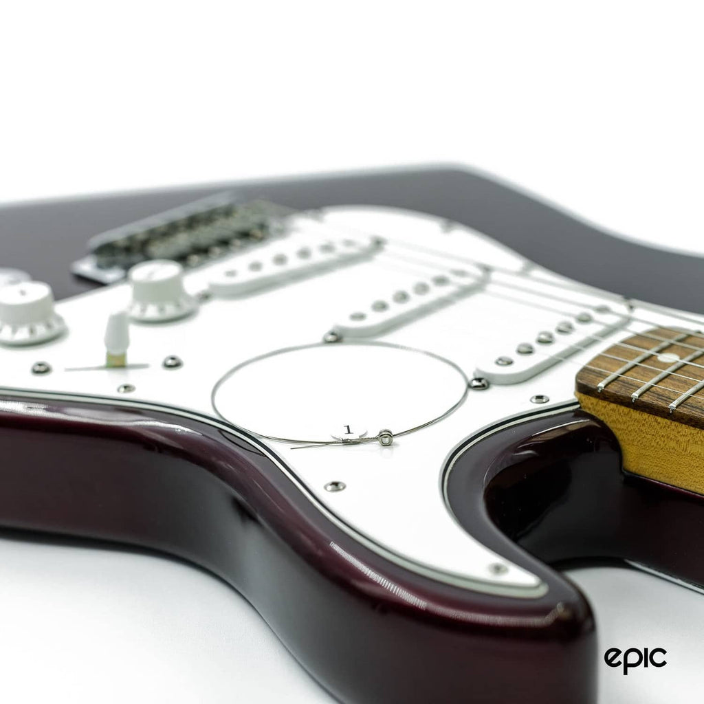 Electric guitar body with installed string labeled 1 and pickup/control area