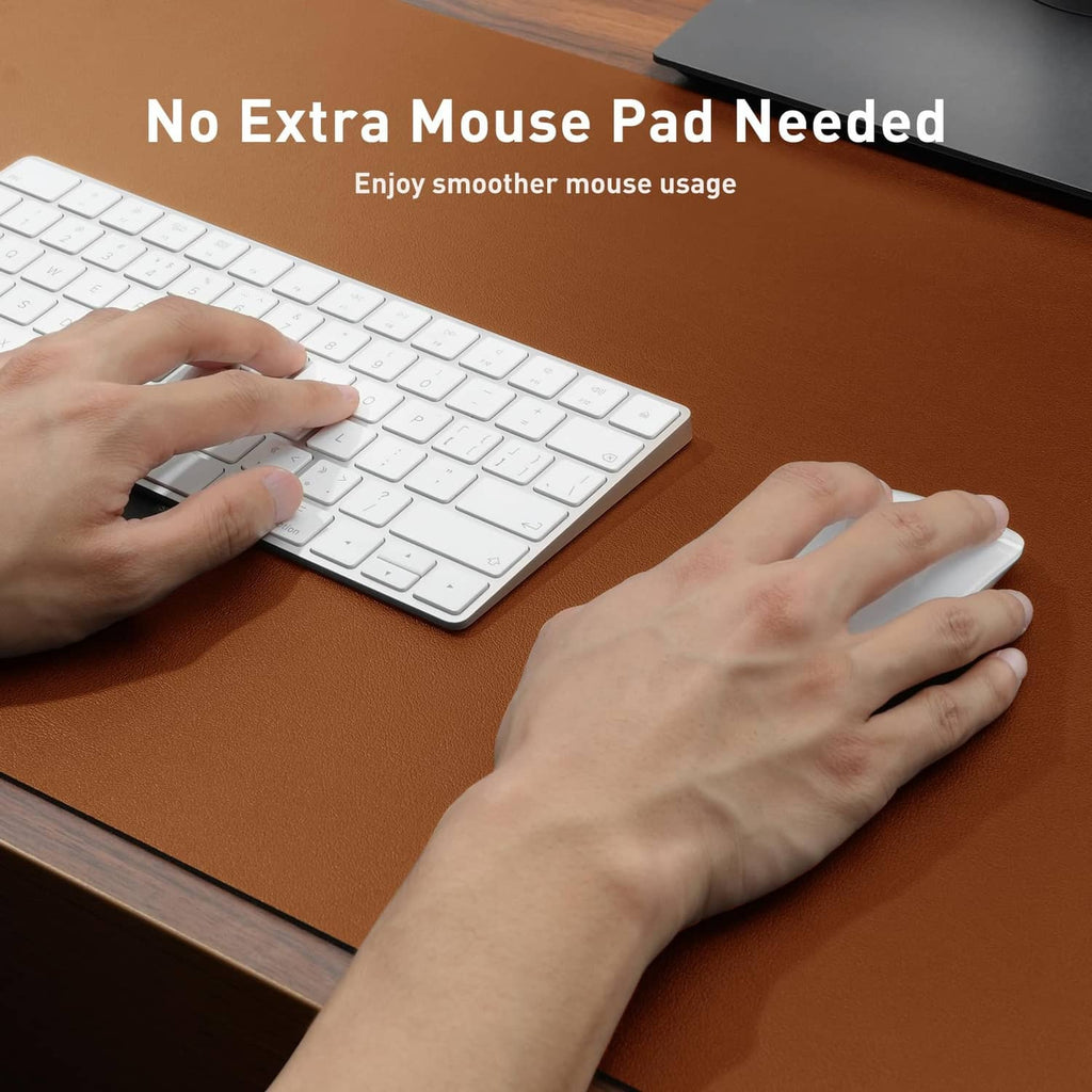 Brown desk pad protector with smooth surface, hands adjusting keyboard and mouse