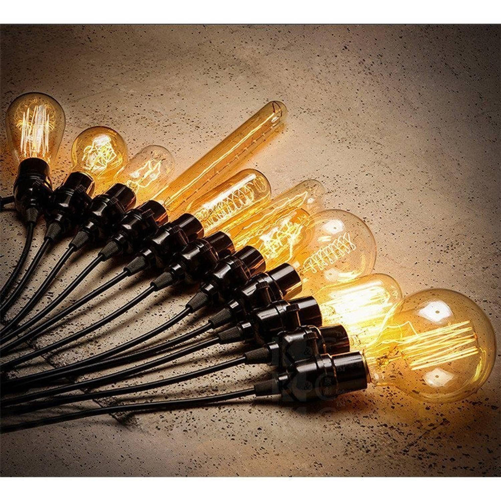 Row of C35 LED chandelier bulbs with clear glass flame filaments and E14 bases.
