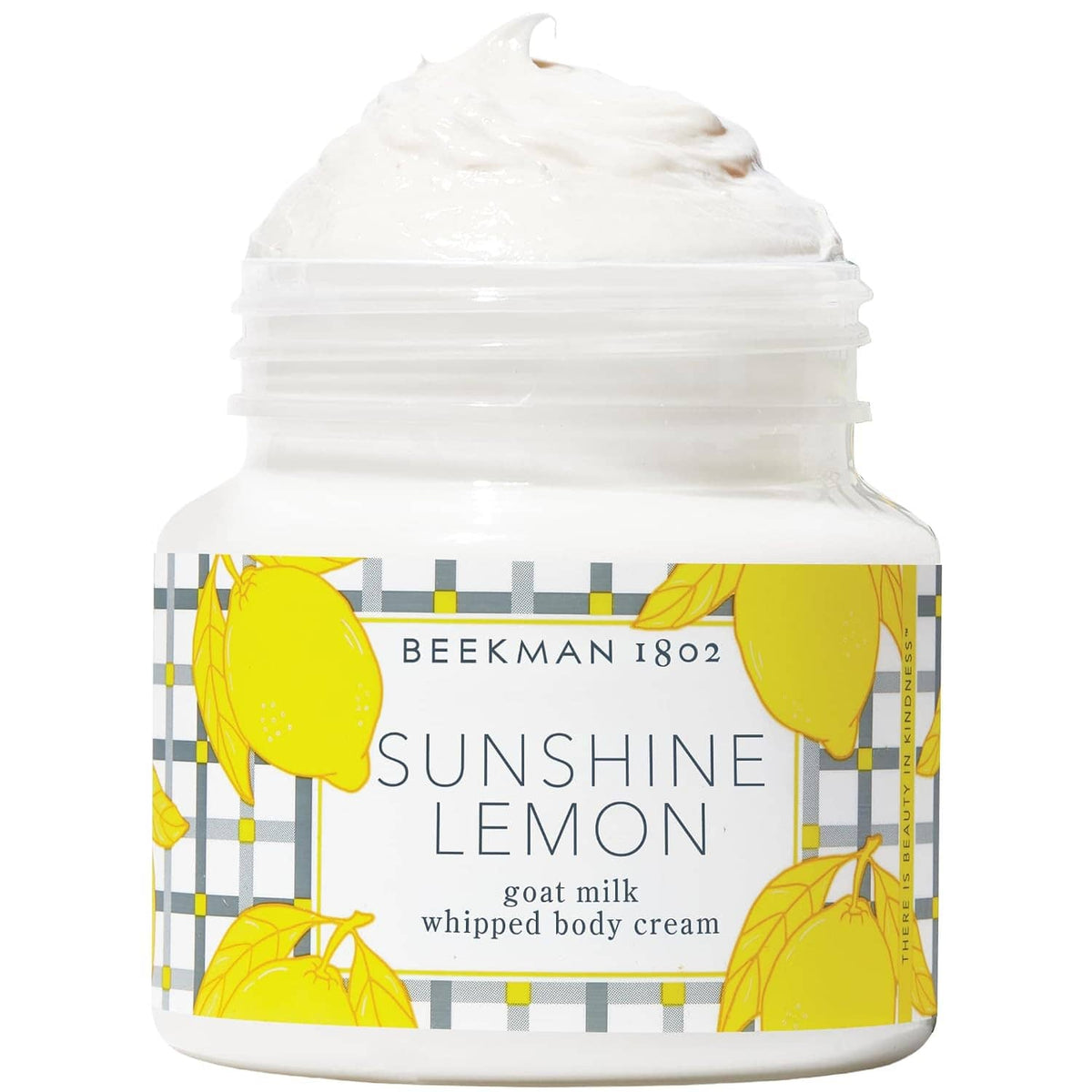 Whipped body cream jar labeled Sunshine Lemon goat milk, topped with thick white cream