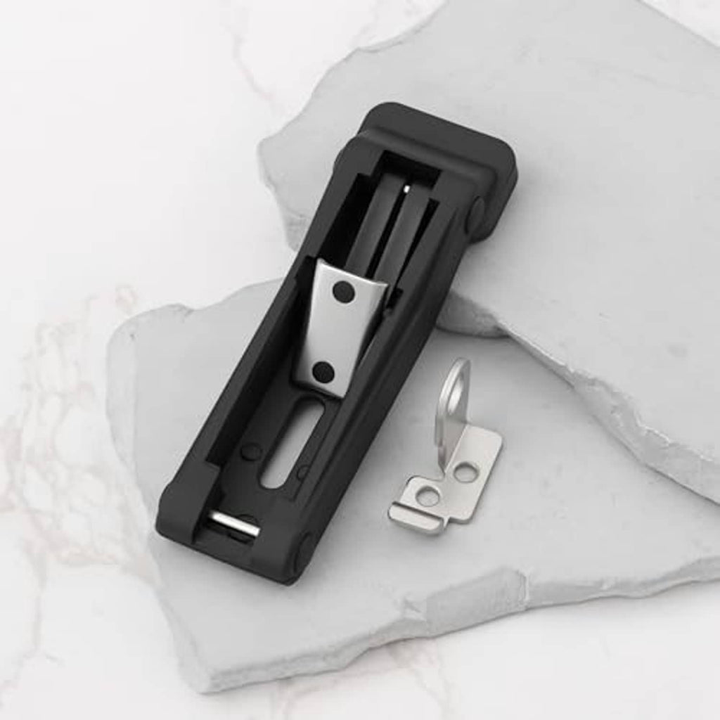 Black rubber latch insert with silver mounting plate and hardware, shown detached