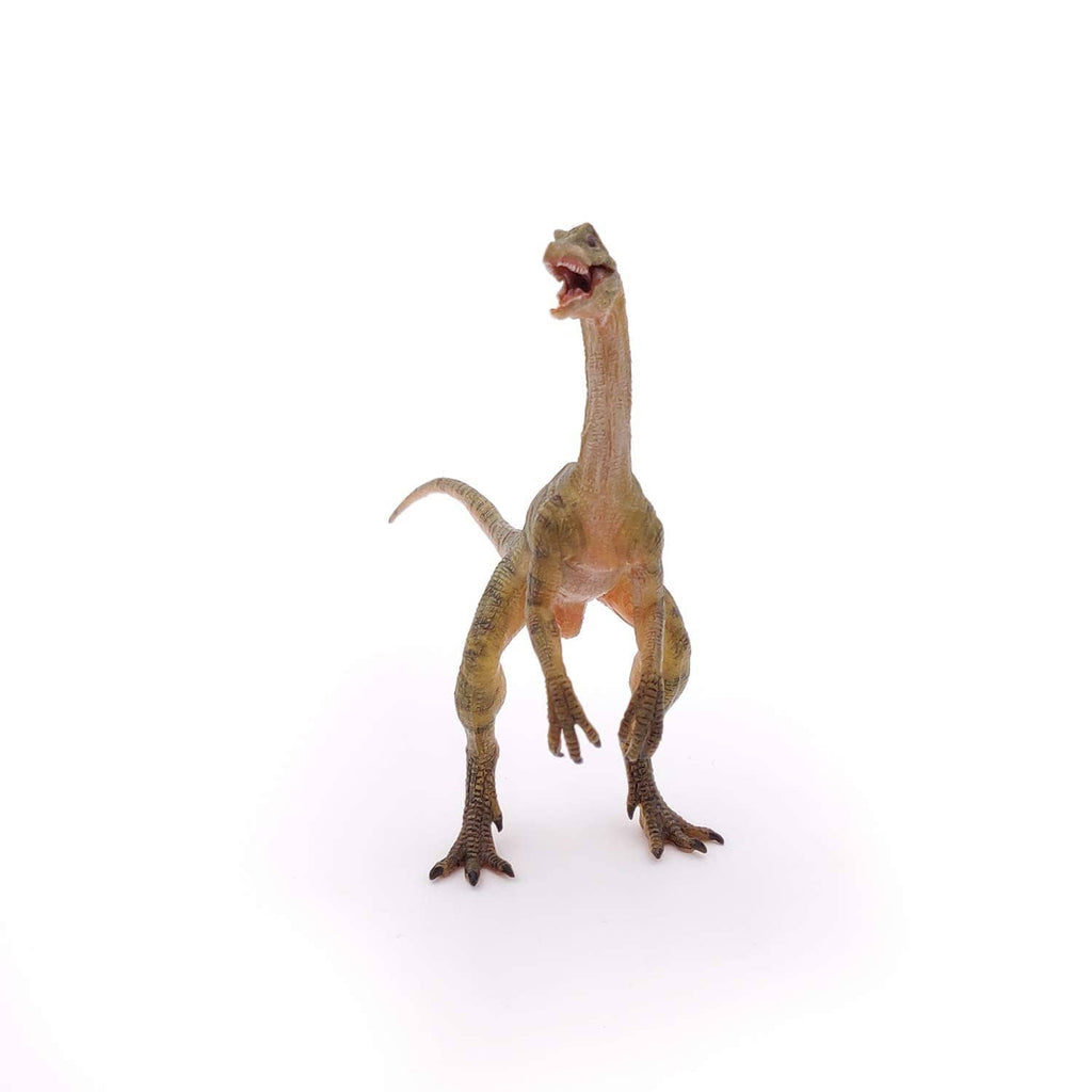 Small Compsognathus dinosaur figurine with raised head and detailed feet.