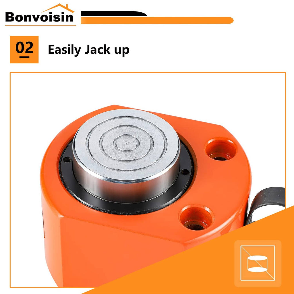 Hydraulic ram cylinder jack with steel piston head and black base ring on orange body