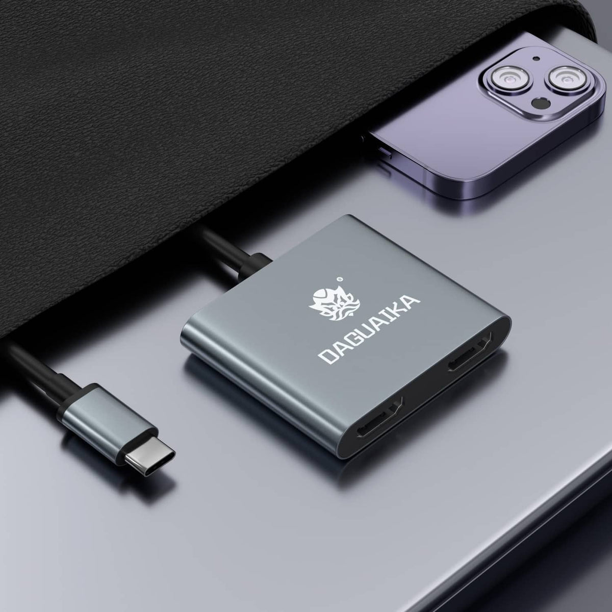 Grey USB-C dual HDMI adapter close-up with HDMI and USB-C ports visible
