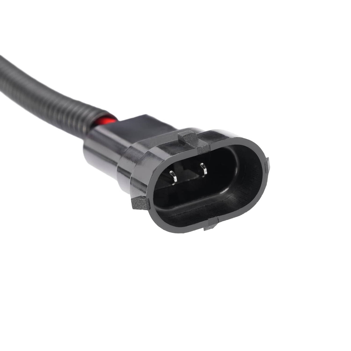 Black connector plug on ribbed wiring cable with small red wire detail