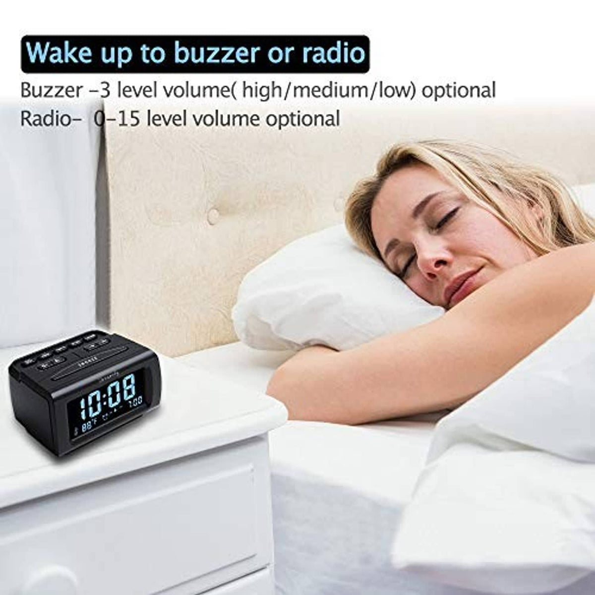 Black alarm clock radio near a bed with a blue LED time display