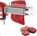 Meat tenderizer attachment rolling into red meat pieces for tenderizing