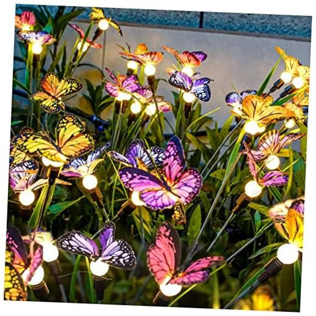 Solar butterfly garden lights: glowing bulbs on stakes with multicolor butterflies