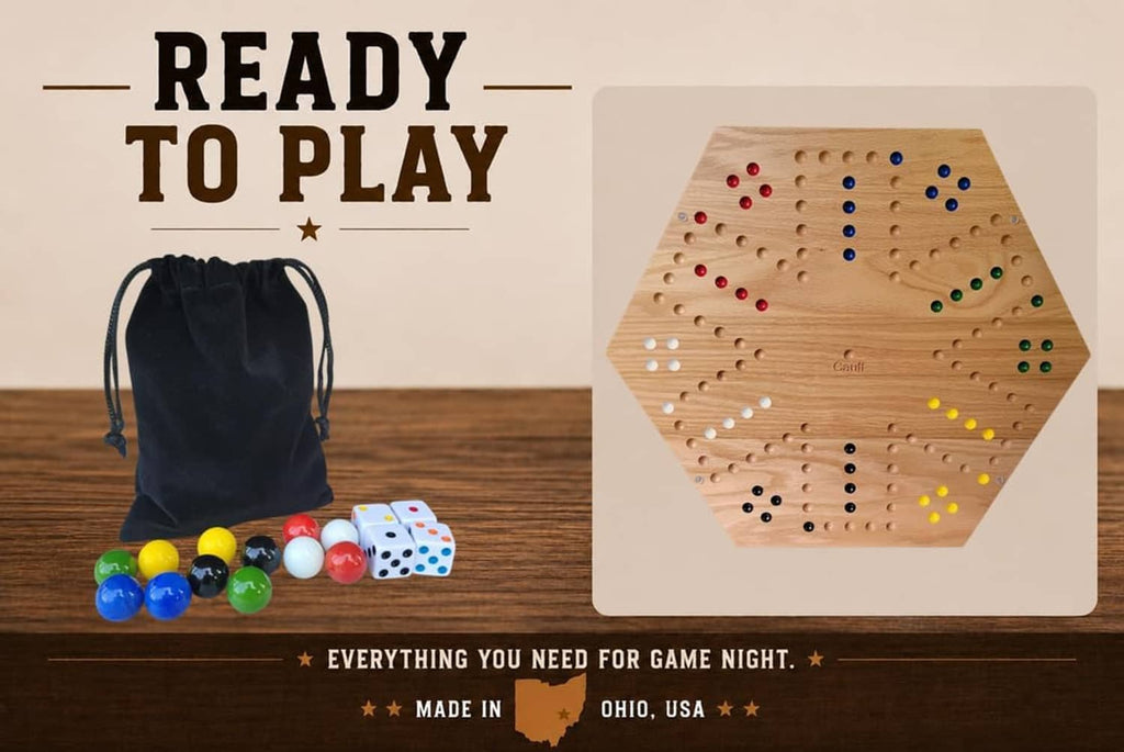 Hex board game with marbles, dice, and a black storage bag