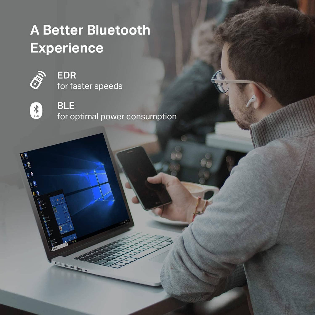 USB Bluetooth adapter in home office setup with laptop and phone, Bluetooth experience icons