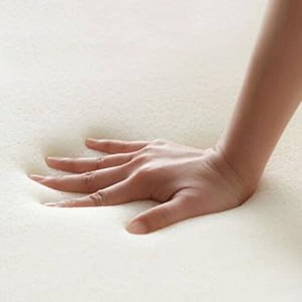 Beige foam seat cushion insert, foot pressing on the surface