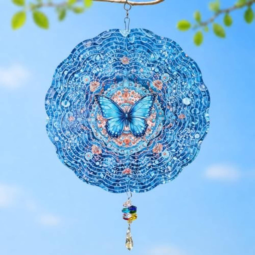Blue butterfly wind spinner with layered swirl design and hanging rainbow crystal drop