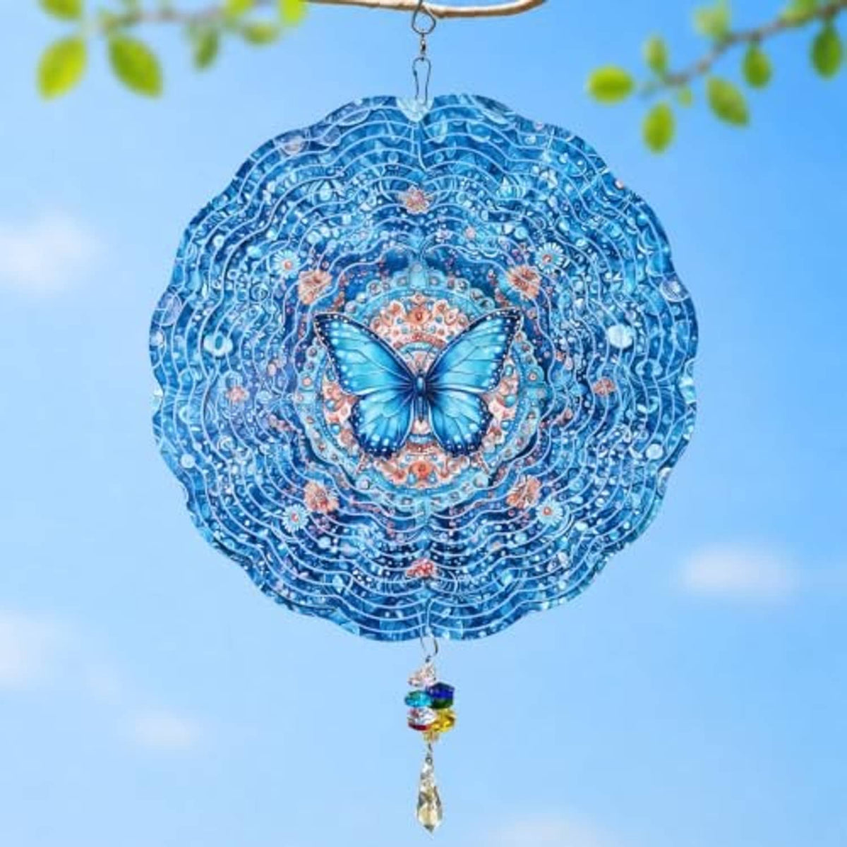 Blue butterfly wind spinner with layered swirl design and hanging rainbow crystal drop