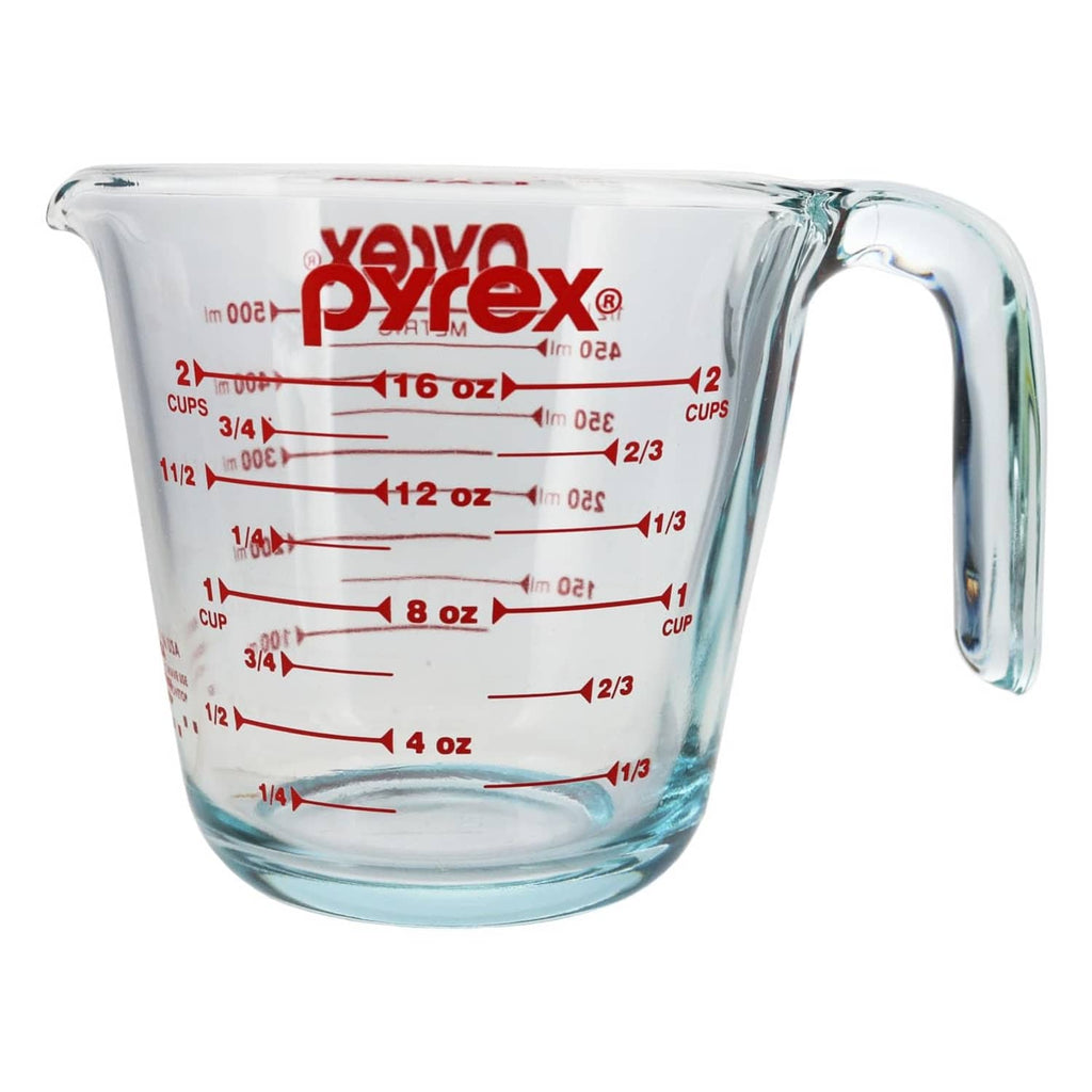 Transparent glass measuring cup with red measurement lines and side handle