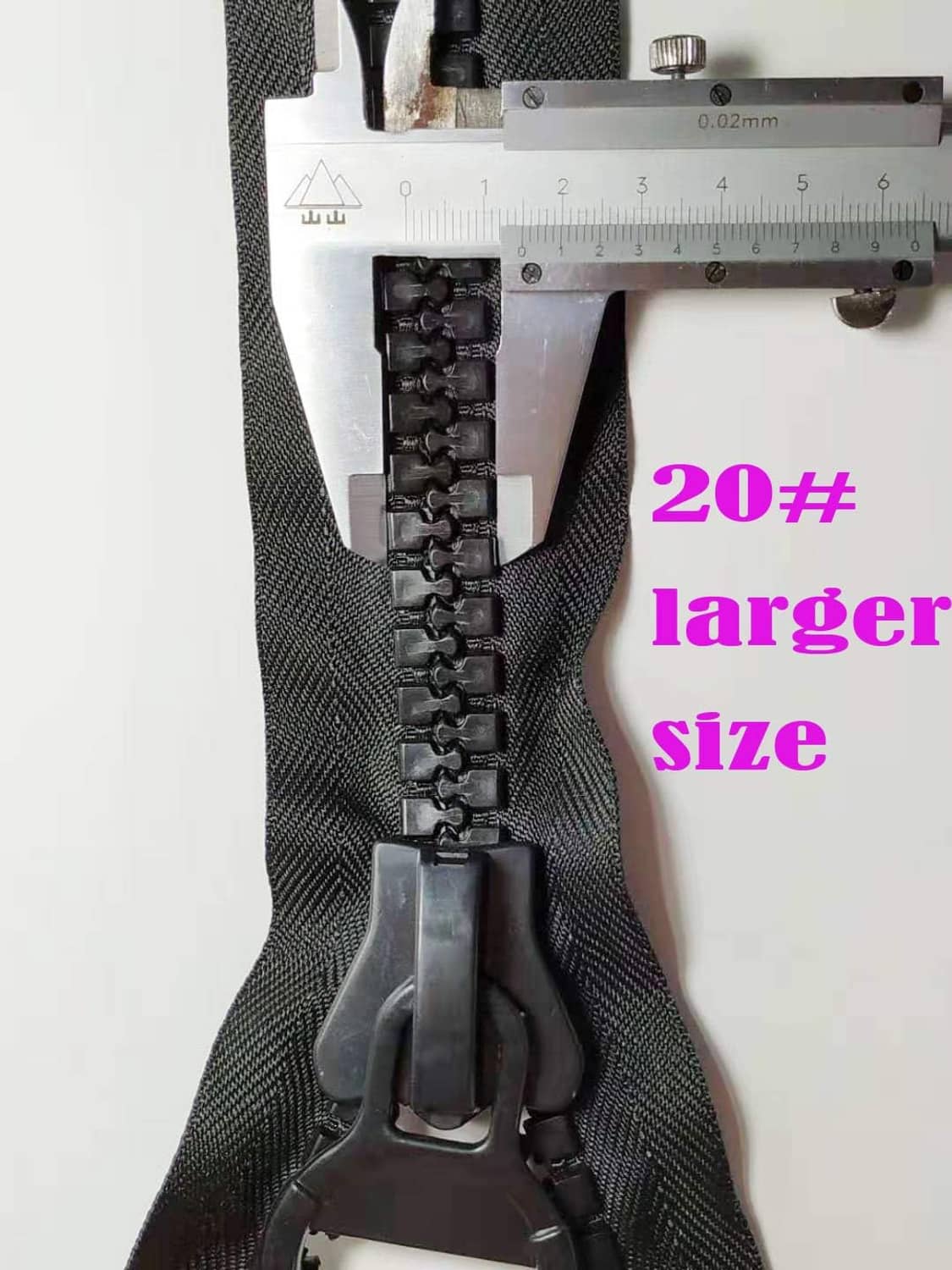 Large dark plastic zipper with black teeth and metal slider