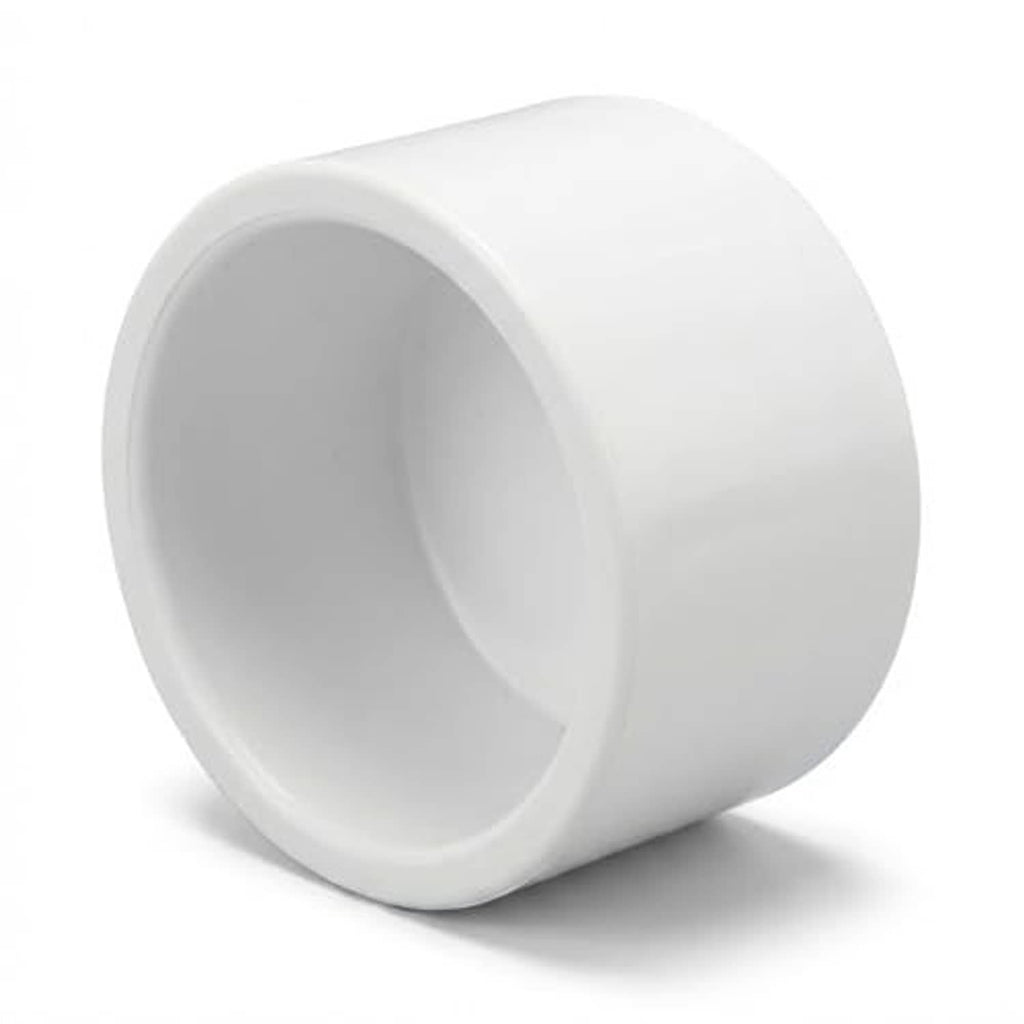 White PVC 1/2 inch pipe end cap plug, side view with inner cavity