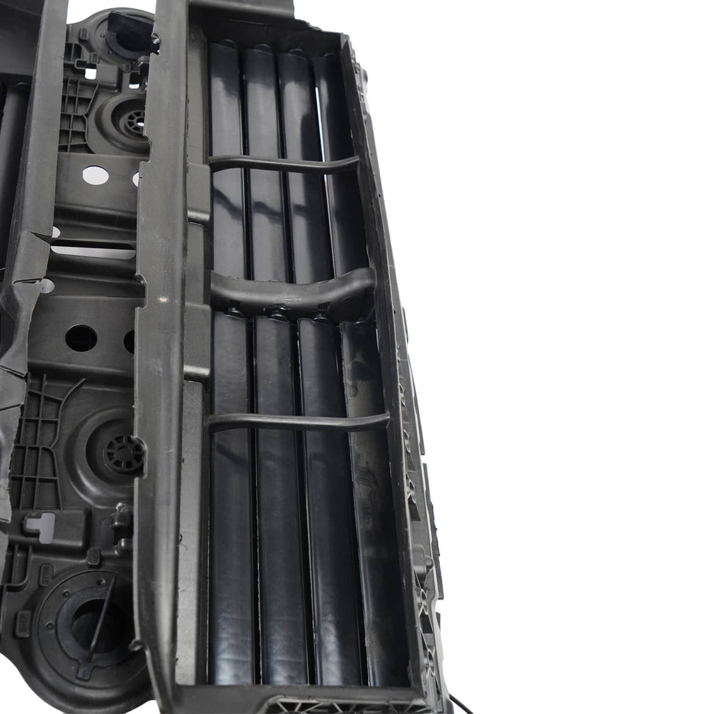 Close-up of inner black grille shutter slats with metal linkage bar