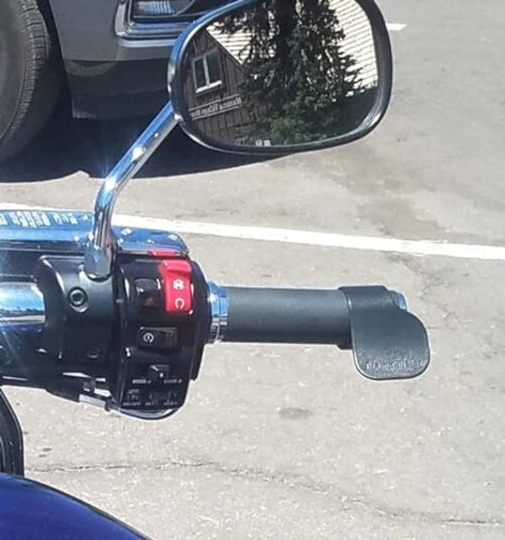 Black throttle-mounted cruise assist controller on motorcycle handlebar