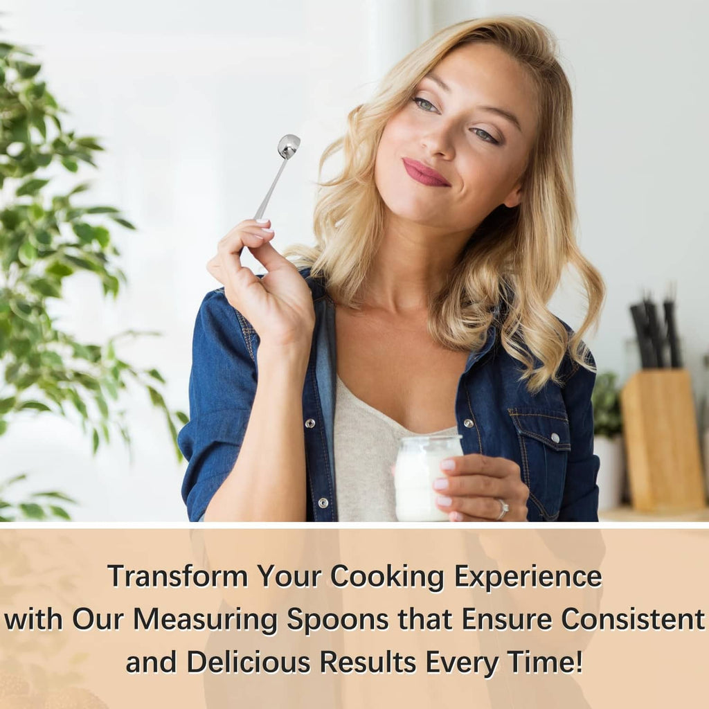 Woman holding a stainless steel measuring spoon and a cup while cooking