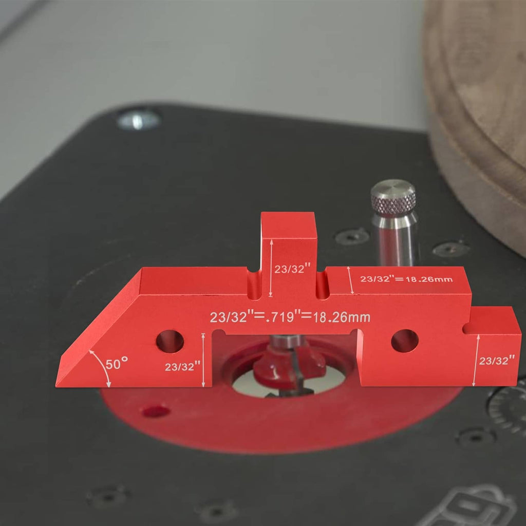 Red aluminum setup block mounted on a work surface with a metal guide pin