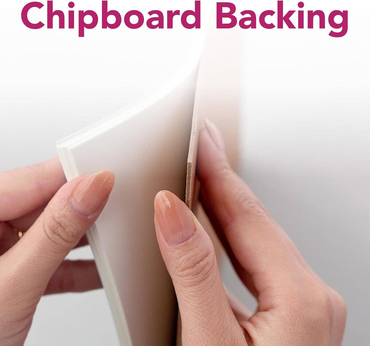Sketch pad with chipboard backing held open by two hands