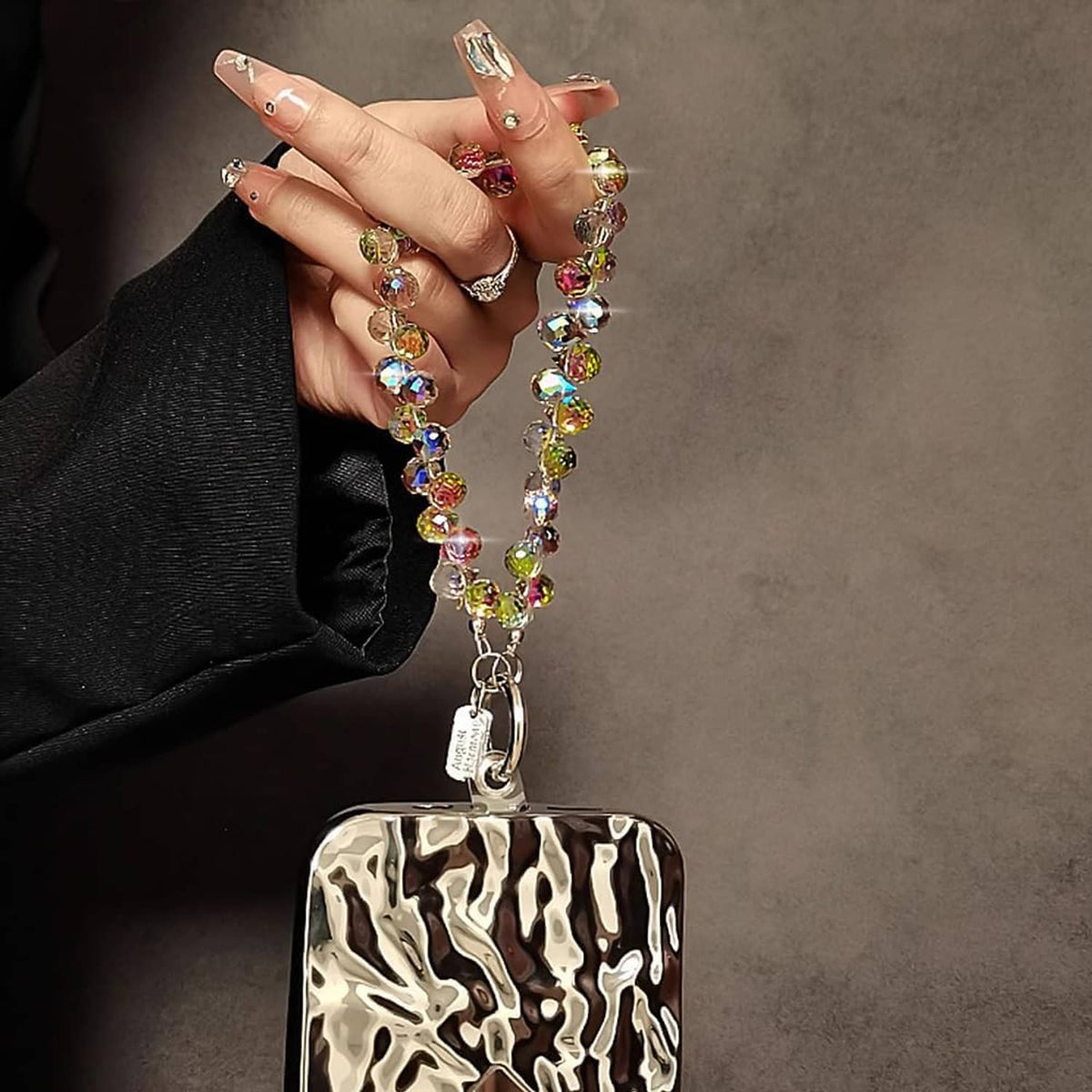 Crystal phone wrist strap with multicolor iridescent beads and decorative metal charm plate