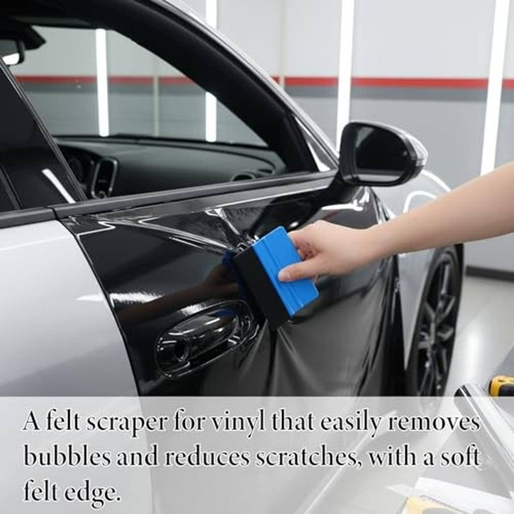 Blue felt-edge vinyl squeegee smoothing window film on a car