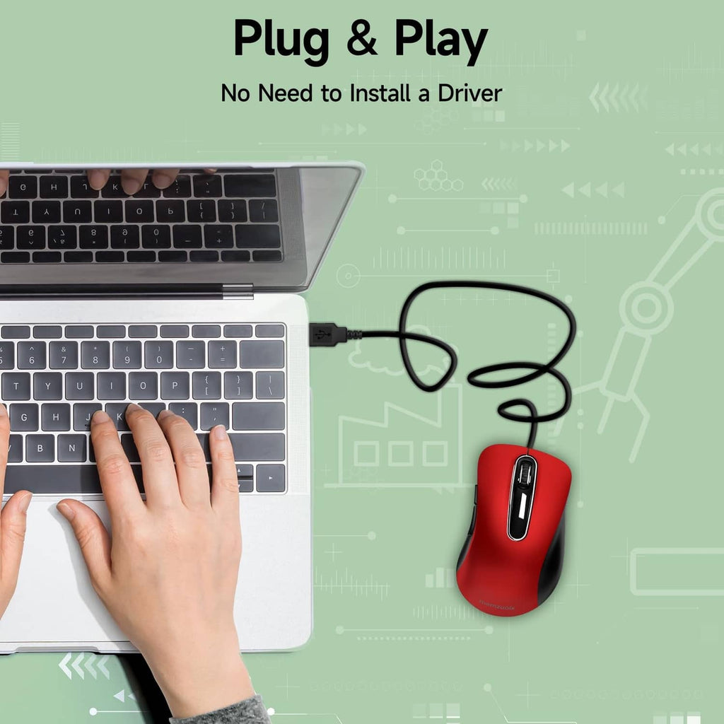 Red USB wired optical mouse with cable next to laptop keyboard