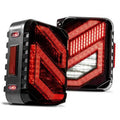 Dark smoked LED tail lights with red light bars and clear reverse section
