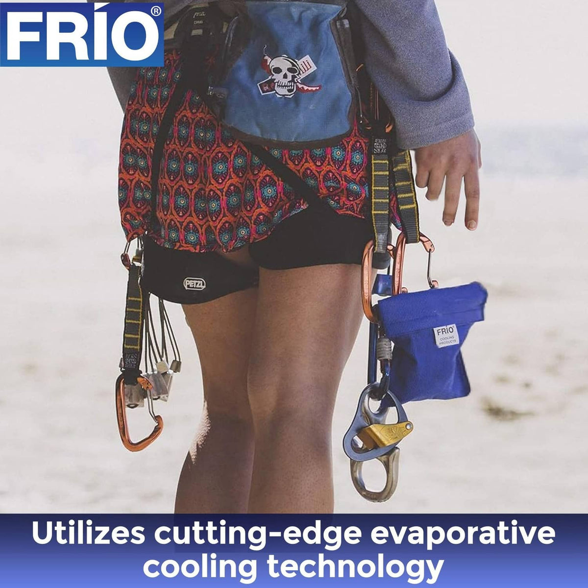 FRIO blue cooling wallet clipped to a strap, with insulin pen-style items