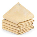 Desert sand shade cloth bundle, neatly folded with metal grommet holes on top edges.