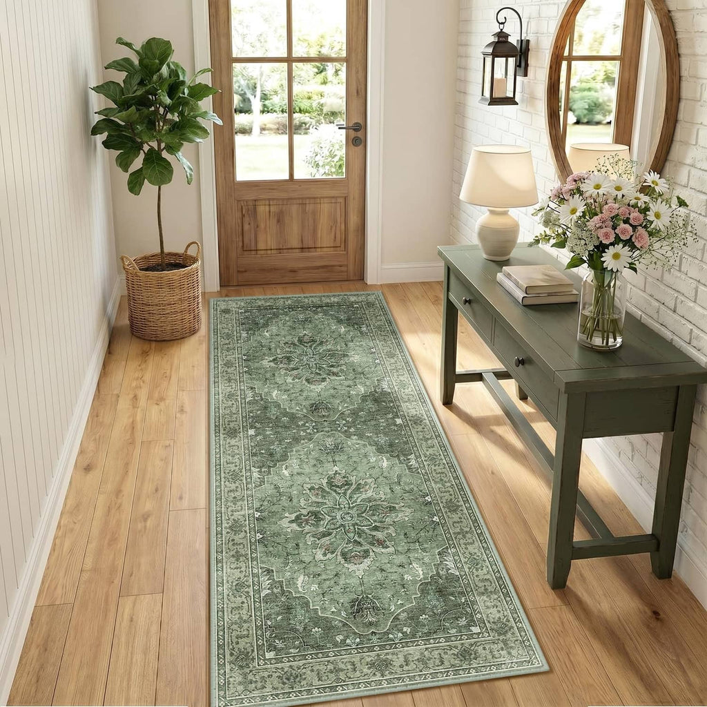 Rectangular green washable area rug with vintage medallion pattern running along a hallway