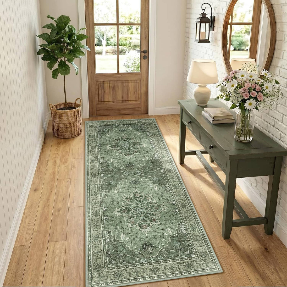 Rectangular green washable area rug with vintage medallion pattern running along a hallway