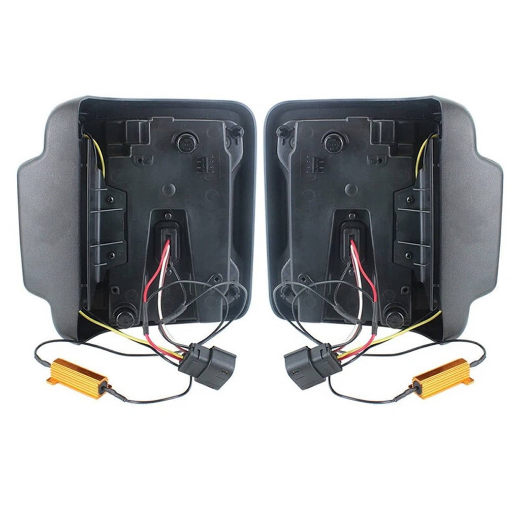 Pair of LED tail light housings with red lens trim and attached wiring leads