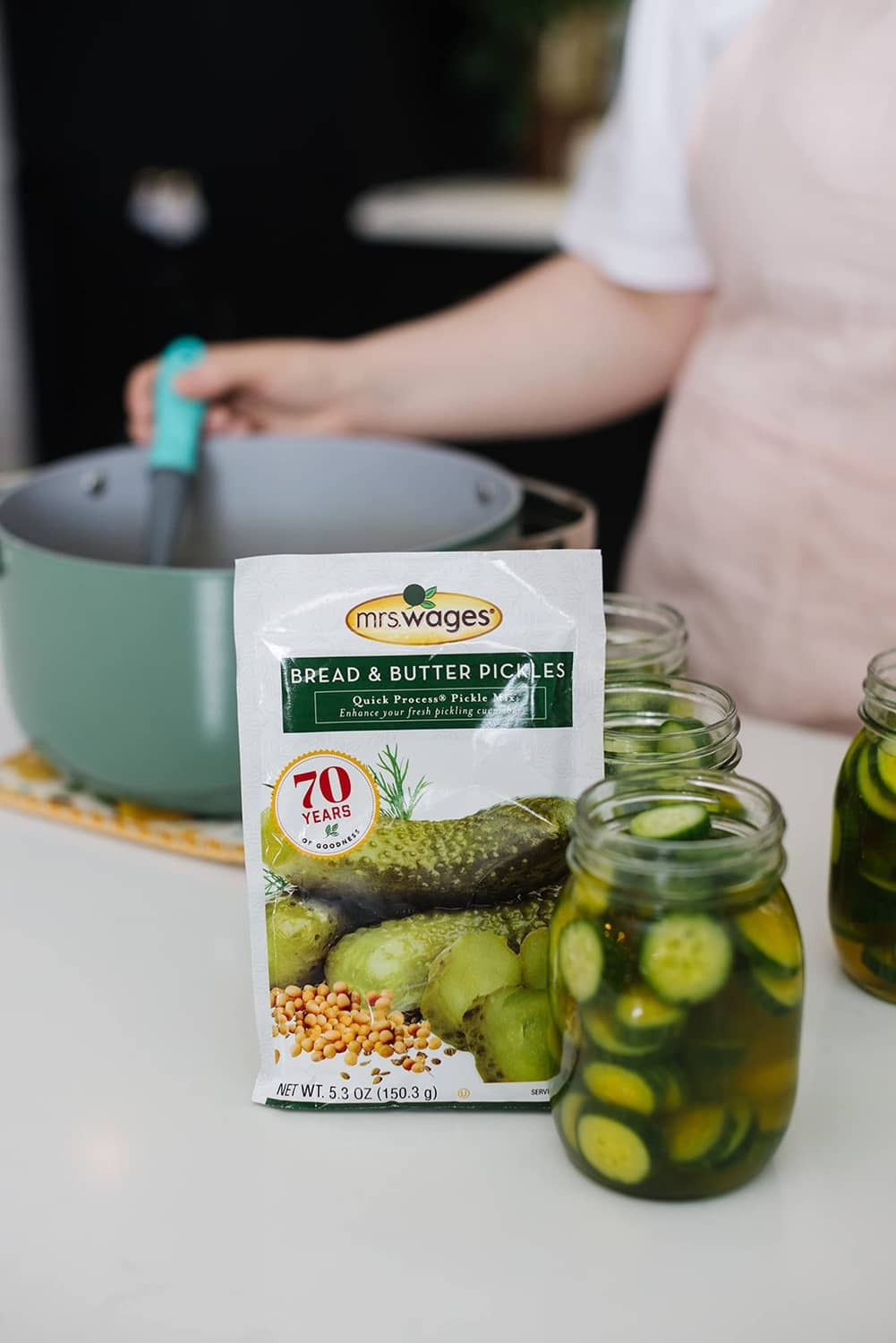 Mrs. Wages Bread & Butter Pickles quick process mix packet beside jars of pickles
