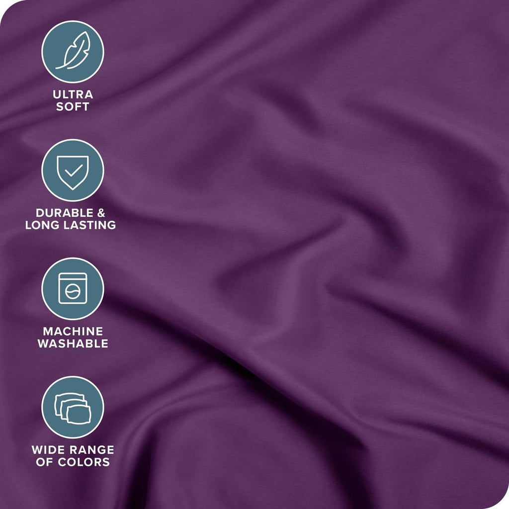 Purple microfiber fitted sheet fabric close-up with smooth, wrinkle-textured surface
