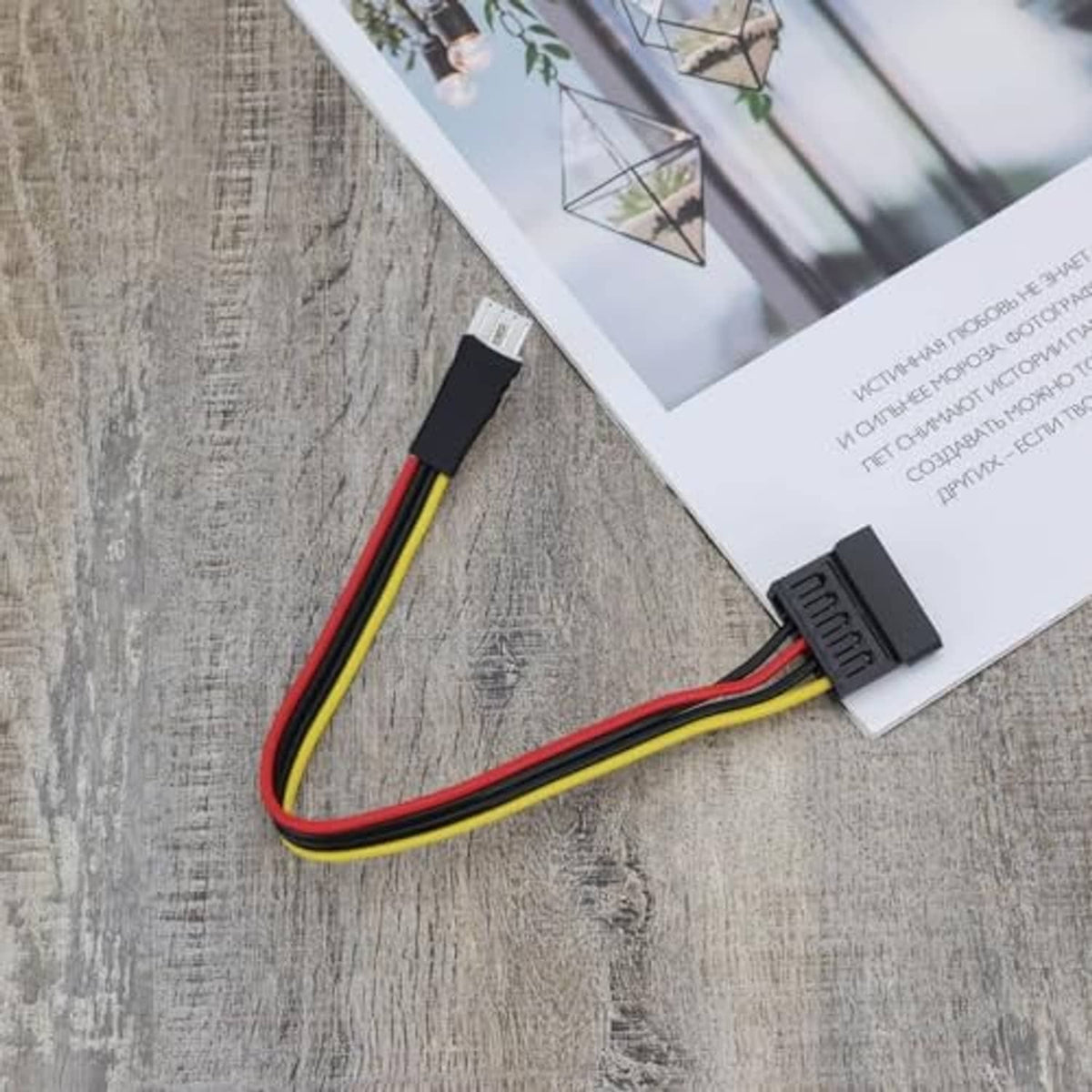 4-pin FDD male adapter end with black connector housing and red/yellow/black wire leads